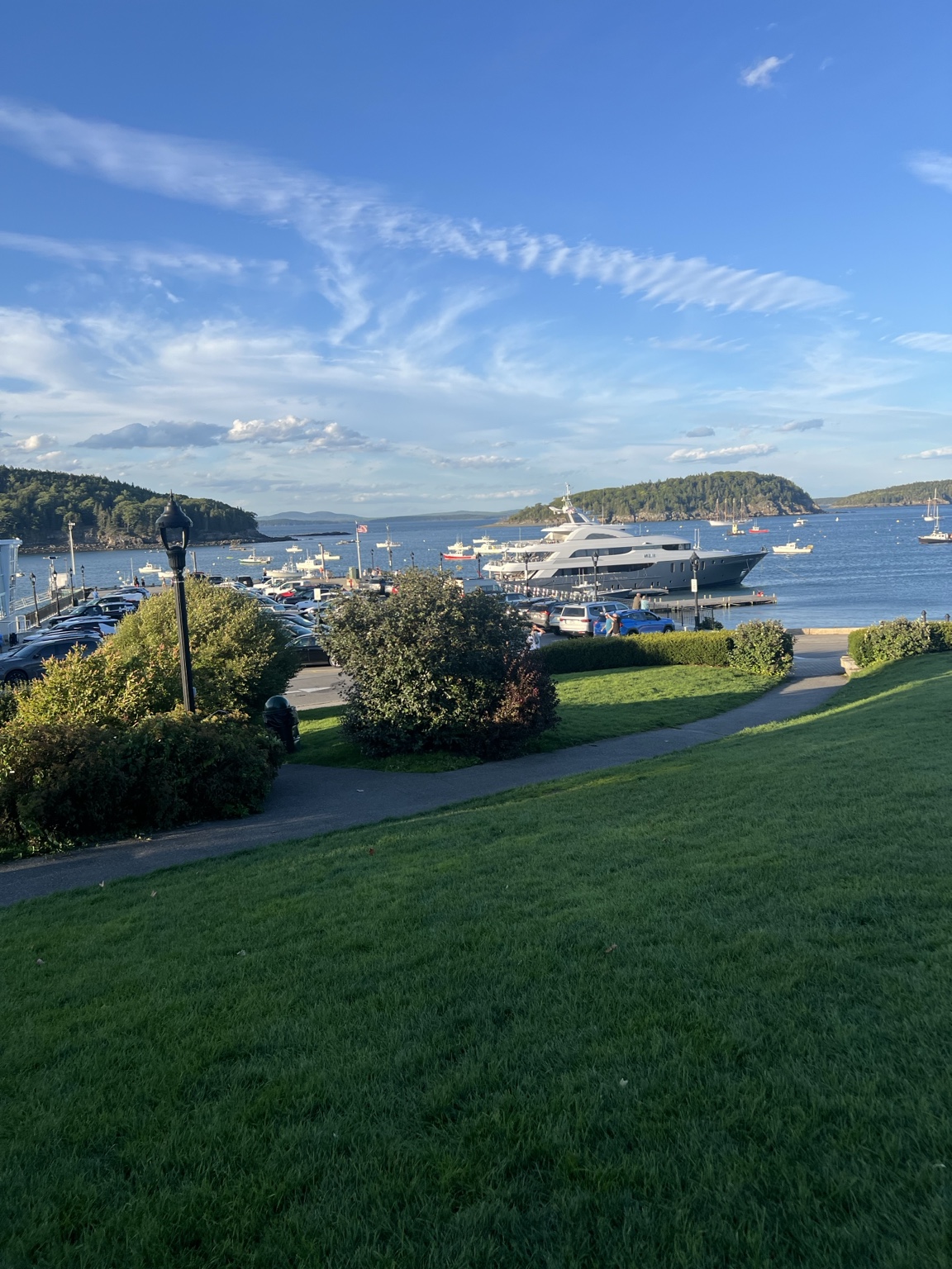 A peaceful harbor in Maine under a bright blue sky